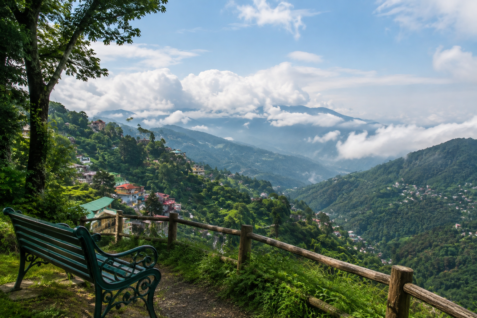 Scenic hill view of Mussoorie with lush green mountains, clouds, and peaceful valley landscape.